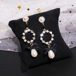 Gold and pearl black ribbon earrings